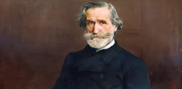 Pintura de Giuseppe Verdi, homem branco, com barba branca e cabelos grisalhos. Ele veste um casaco preto sobre camisa branca e olha diretamente para frente. Seu sembrlante é sério e suas sobrancelhas transmitem calma.